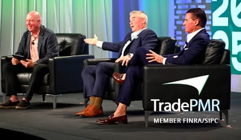 Robb Baldwin and Steve Quick in suits on the Synergy25 stage 